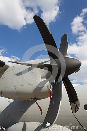 Five Screw Blade Military Aircraft Engine Propeller With A Blue Sky