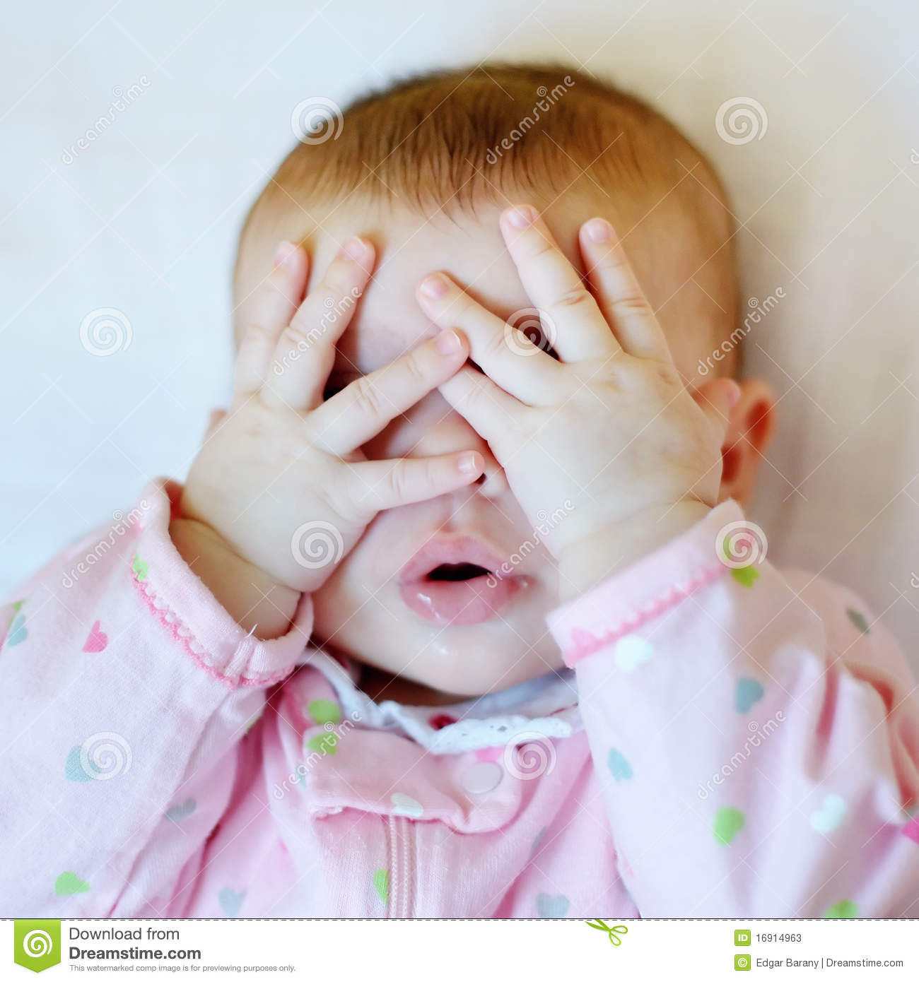 Baby Putting Hands On Face Stock Photos   Image  16914963