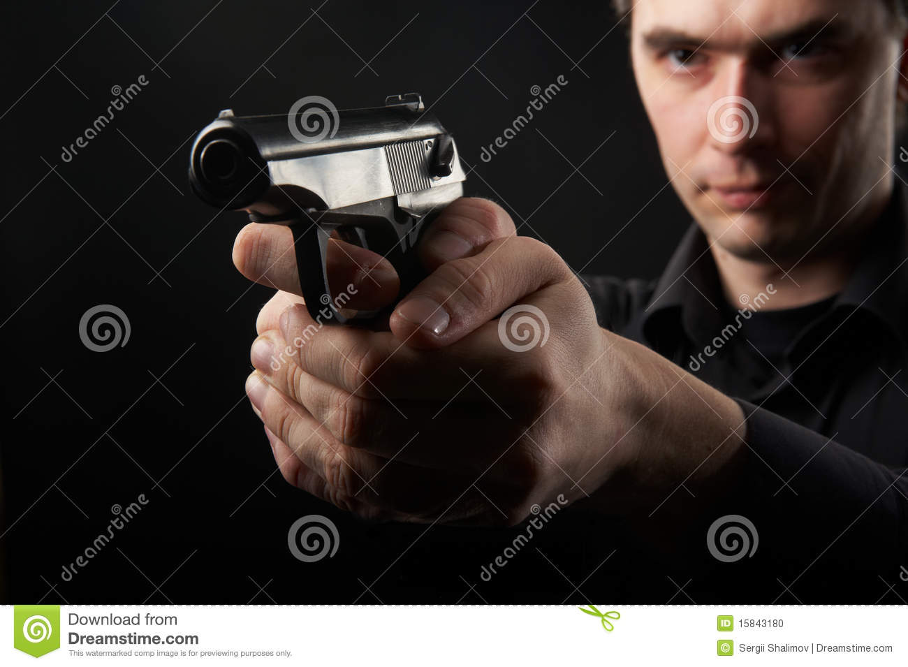 Photo A Young Man Drawing A Gun In Self Defense Studio Shoot 
