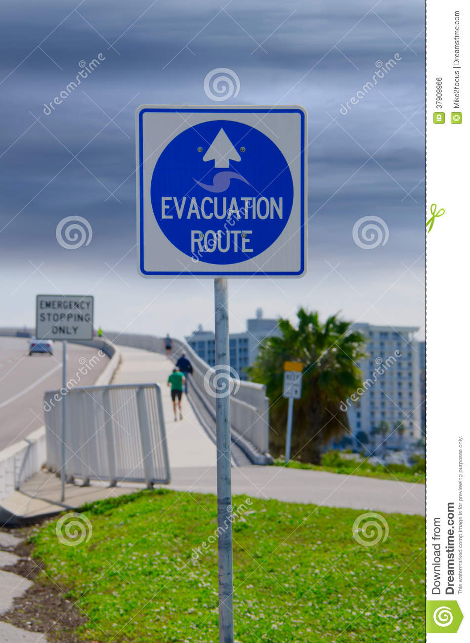 Emergency Evacuation Route Sign And Running People Royalty Free Stock    
