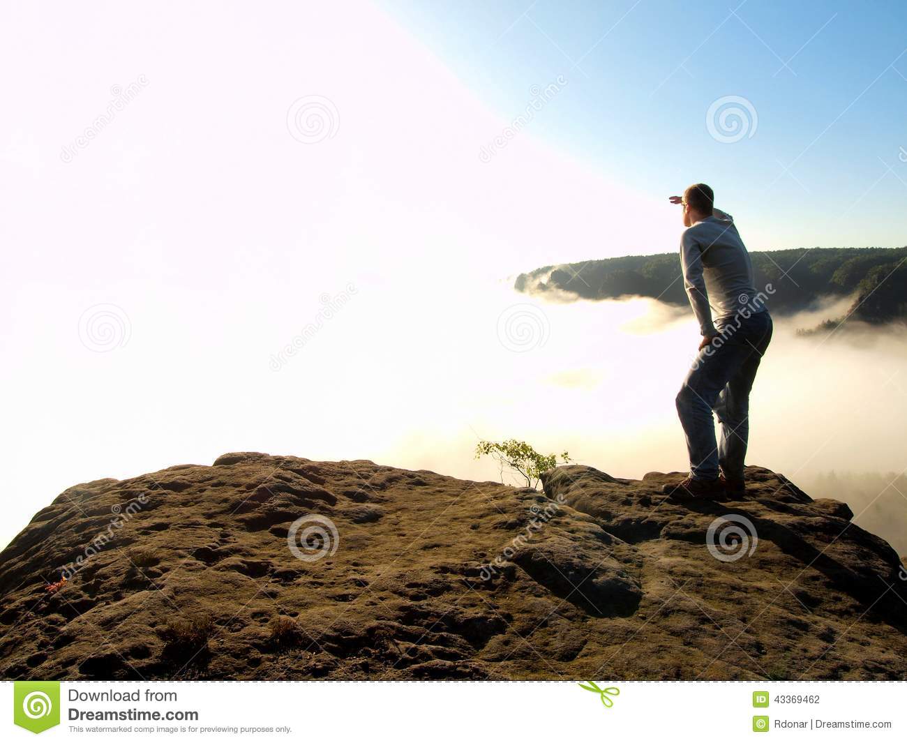 Man Is Standing On The Peak Of Sandstone Rock In National Park Saxony