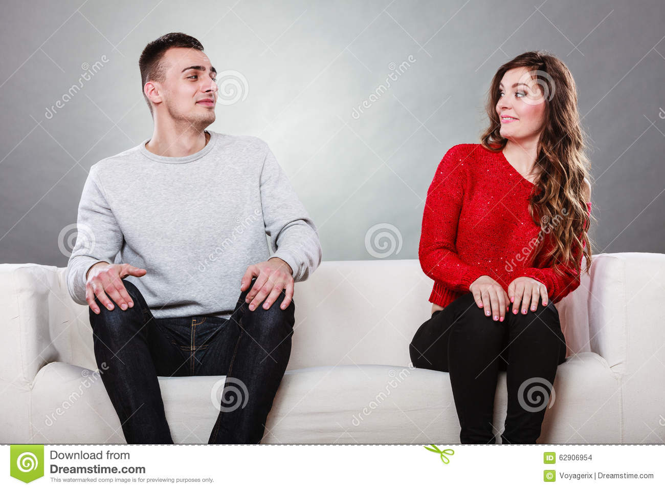 Shy Women And Men Sitting On Sofa Couch Near Each Other  First Date