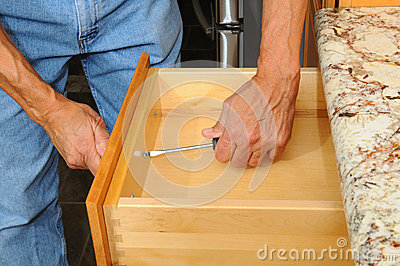 Cabinet Insataller Working On Drawer Royalty Free Stock Image   Image