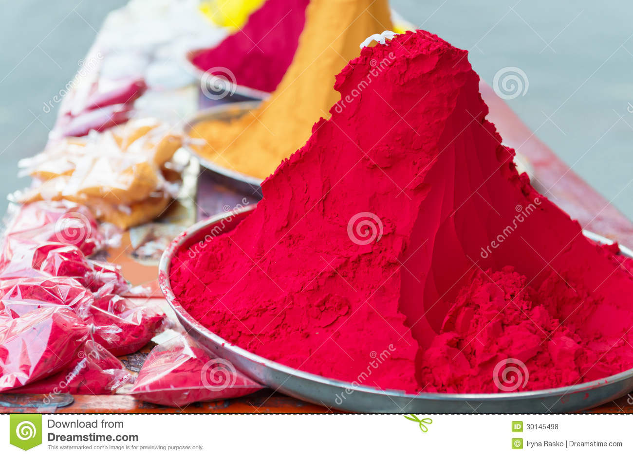 Piles And Mounds Of Indian Colorful Dye Powders For Holy Festival And