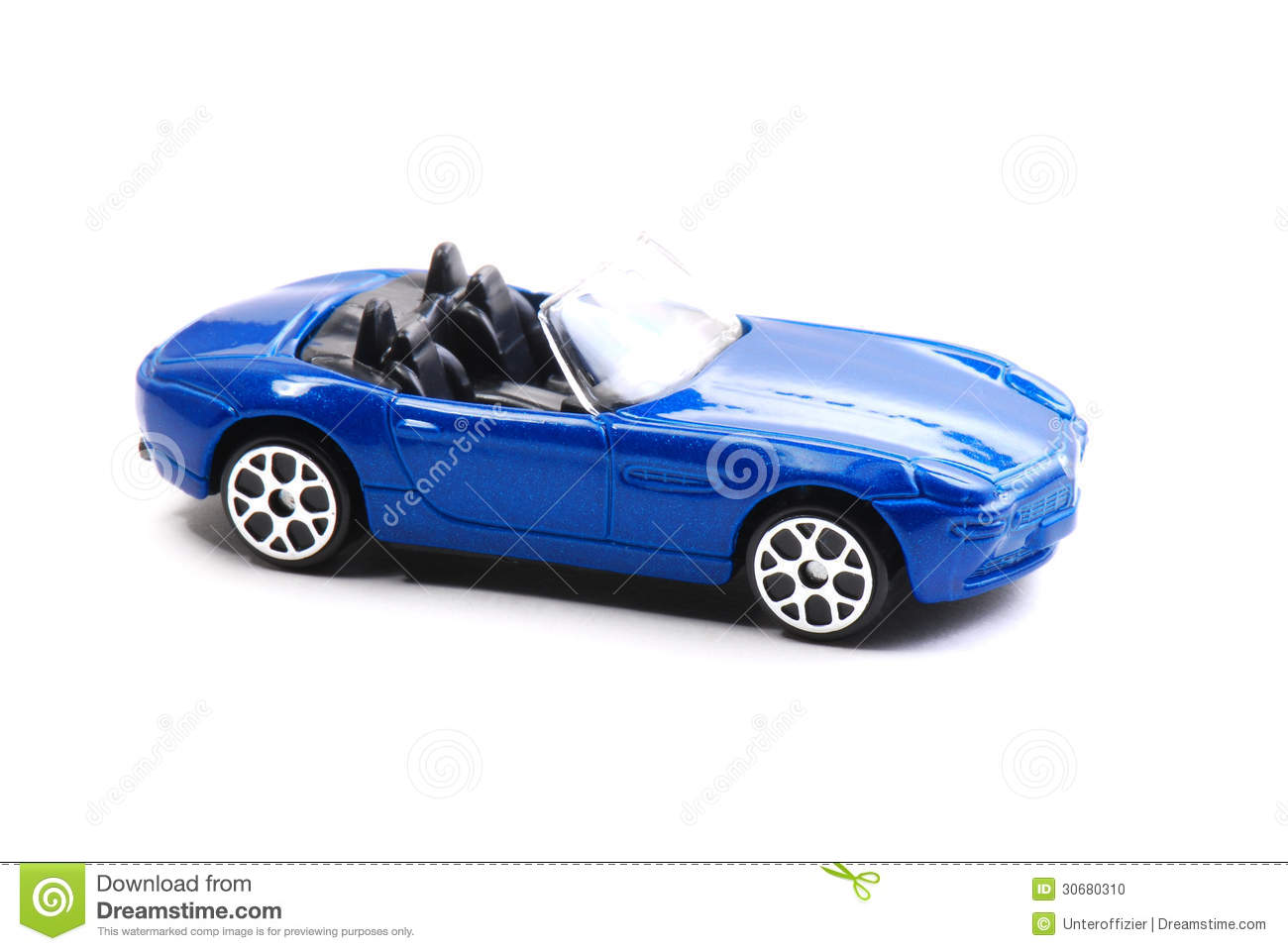 Blue Painted Toy Convertible Car Against A White Backdrop