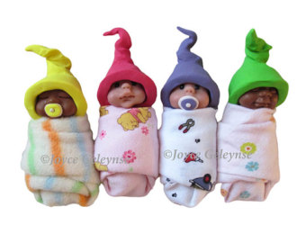 Photo Clip Art Four Swaddled Babies In A Row Polymer Clay Sculptures    