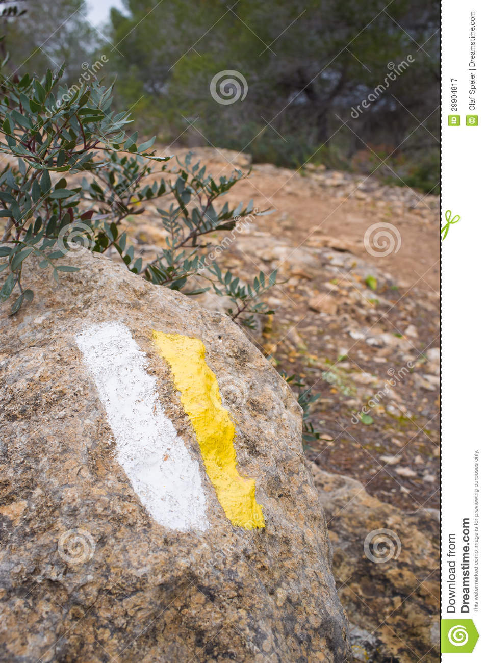 Trail Marker Painted On Rocky Soil With The Hiking Trail In The    