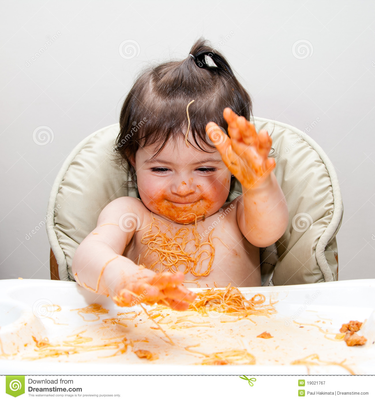 Happy Baby Having Fun Eating Messy Slapping Hands Covered In Spaghetti