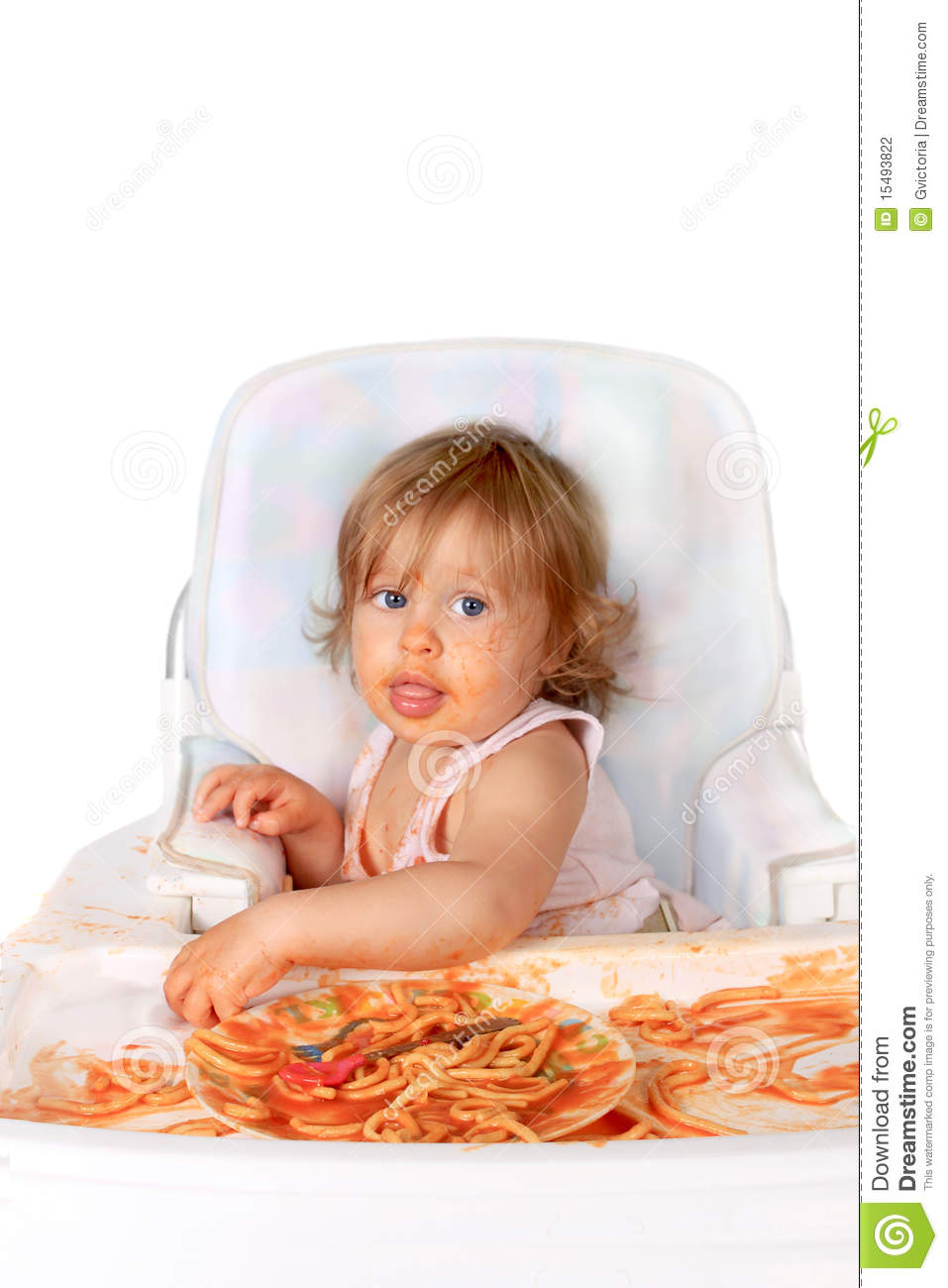 Young Blue Eyed Baby Girl Making A Mess With Spaghetti In Tomato Sauce