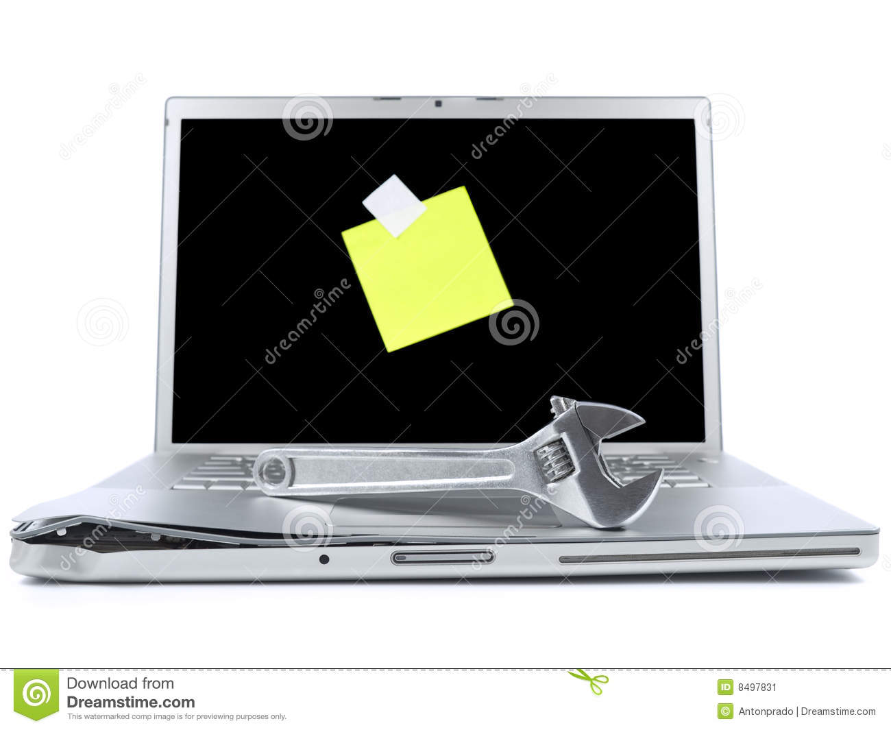 Damaged Laptop With A Spanner Over It And A Blank Post It On The