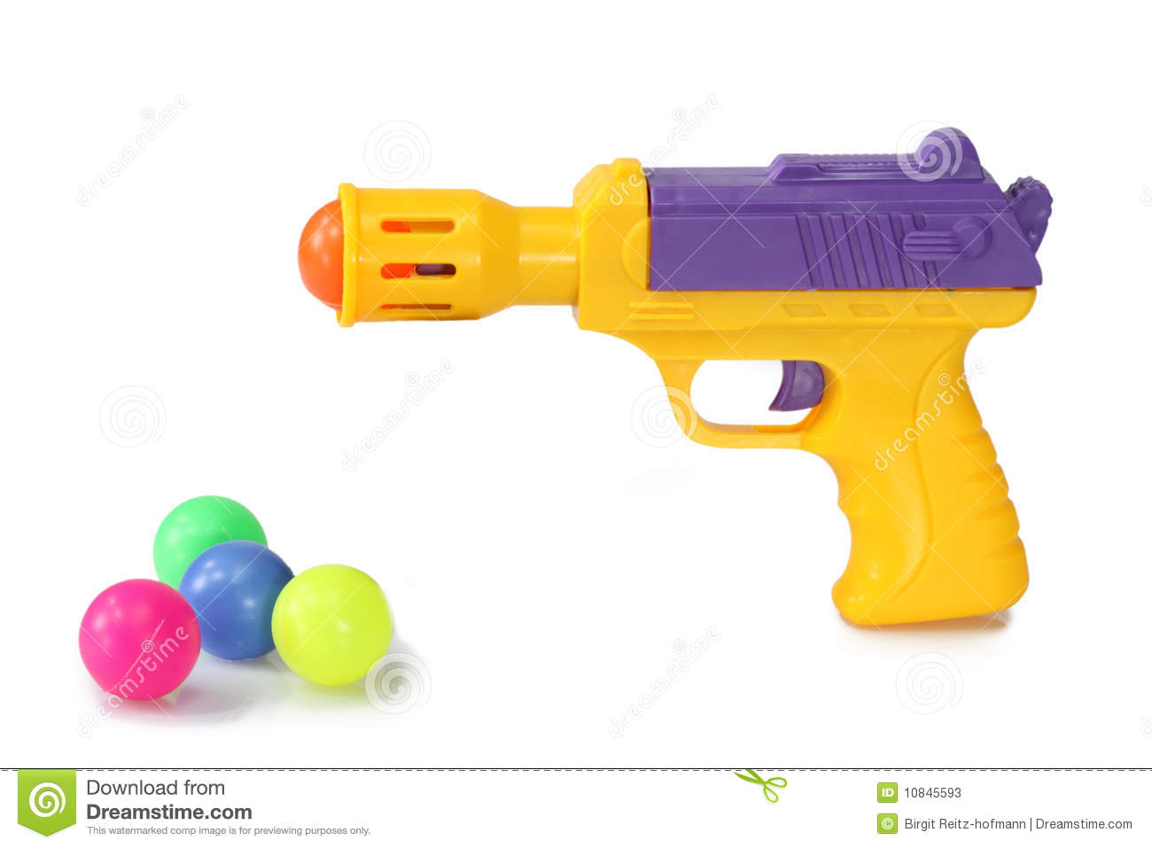 Toy Gun With Plastic Balls On White Background