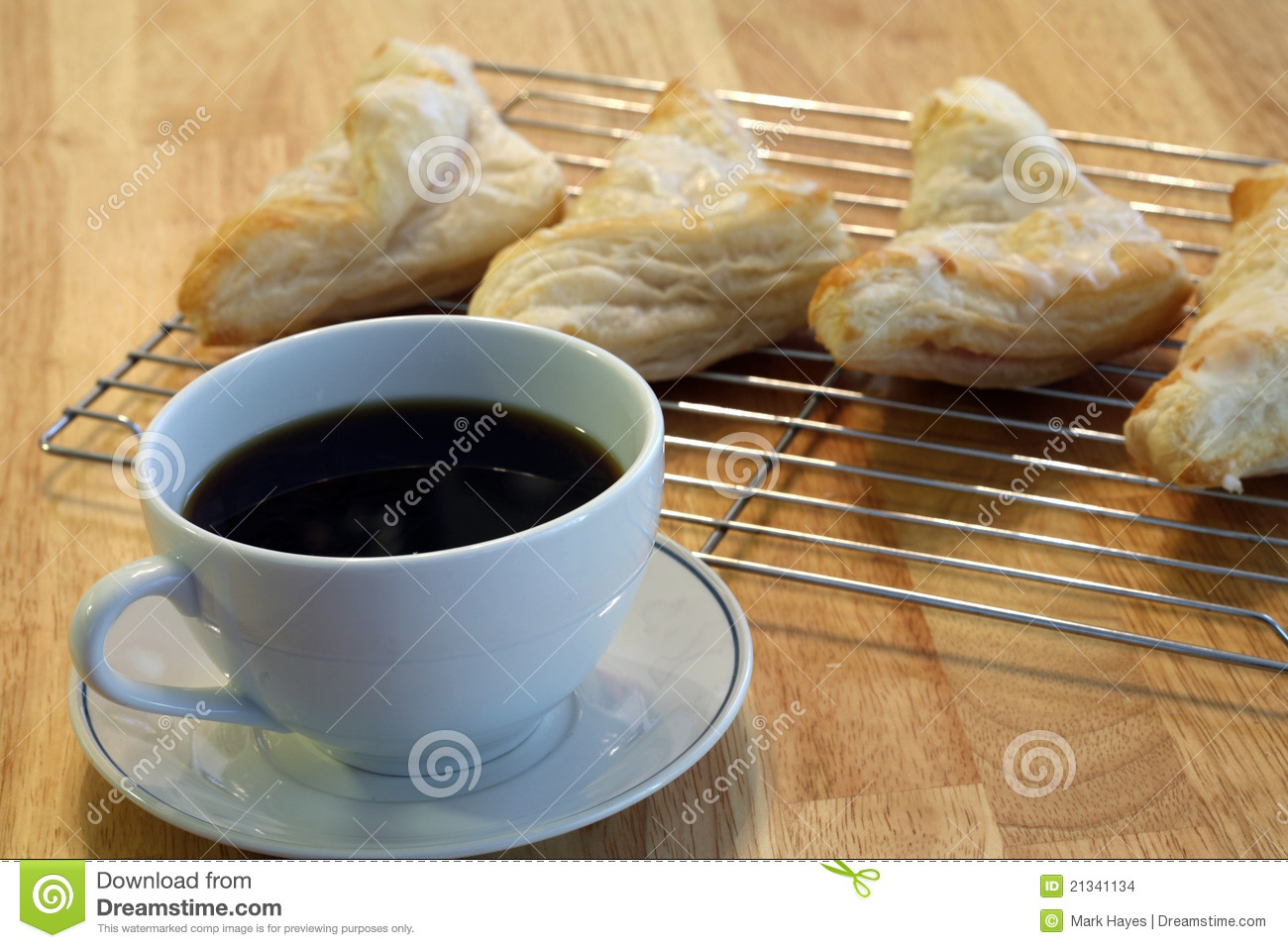 Cup Of Hot Coffee And A Fresh Backed Pastry For Breakfast 