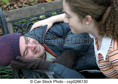 Homeless Man Being Helped By A Teen Volunteer   Focus On Homeless