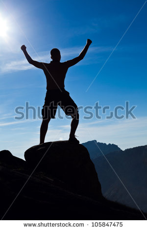 Man Climbing In Mountains Arms Outstretched Success Concept
