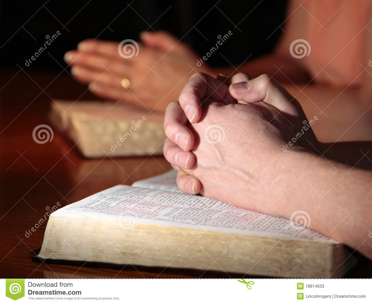 Man And Woman Praying With Holy Bibles Stock Photos   Image  18614633