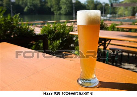 Picture   A Glass Of Wheat Beer In A German Beer Garden  Fotosearch