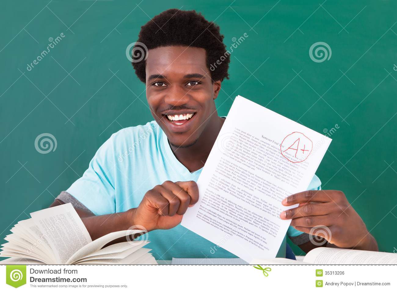 Young Man Showing A Paper With Grade A Plus Royalty Free Stock Image