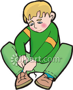 Little Boy Tying His Shoes   Royalty Free Clipart Picture