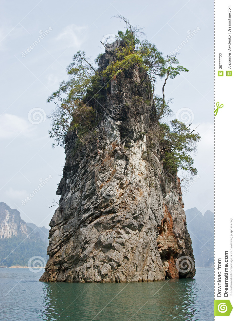 Giant Solid Rock Forming An Island In The Middle Of A Lake 