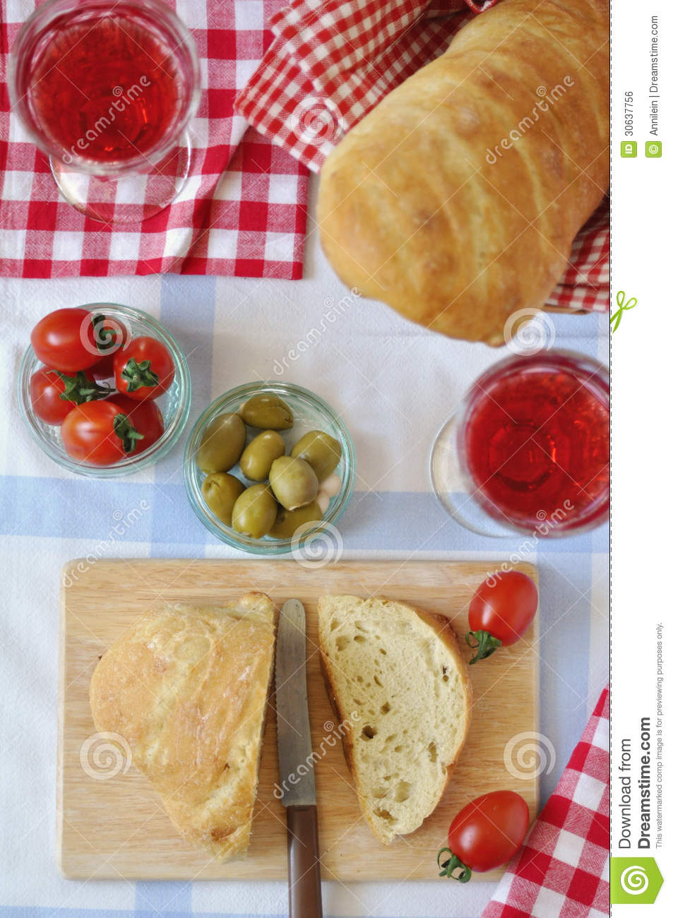 Italian Table Setting With Fresh Bread Tomatoes Olives Red Wine    