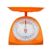 Stock Image Of Red Kitchen Scales With A Pile Of Gold Being Weighed