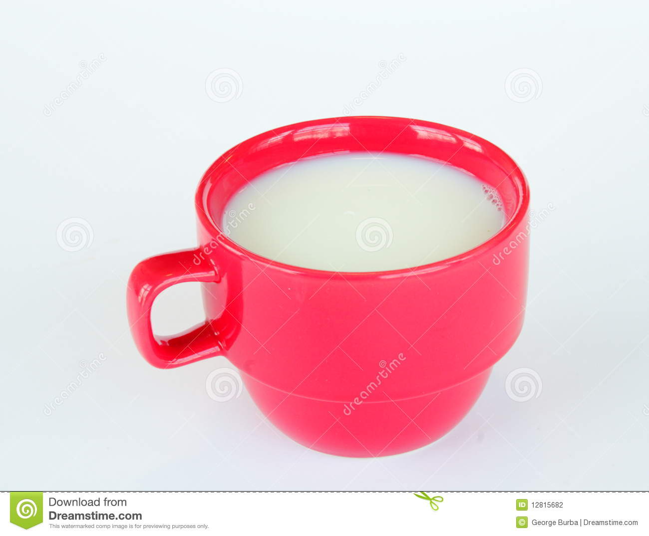 The Cup Full Of Milk Or Cream On Light Background 