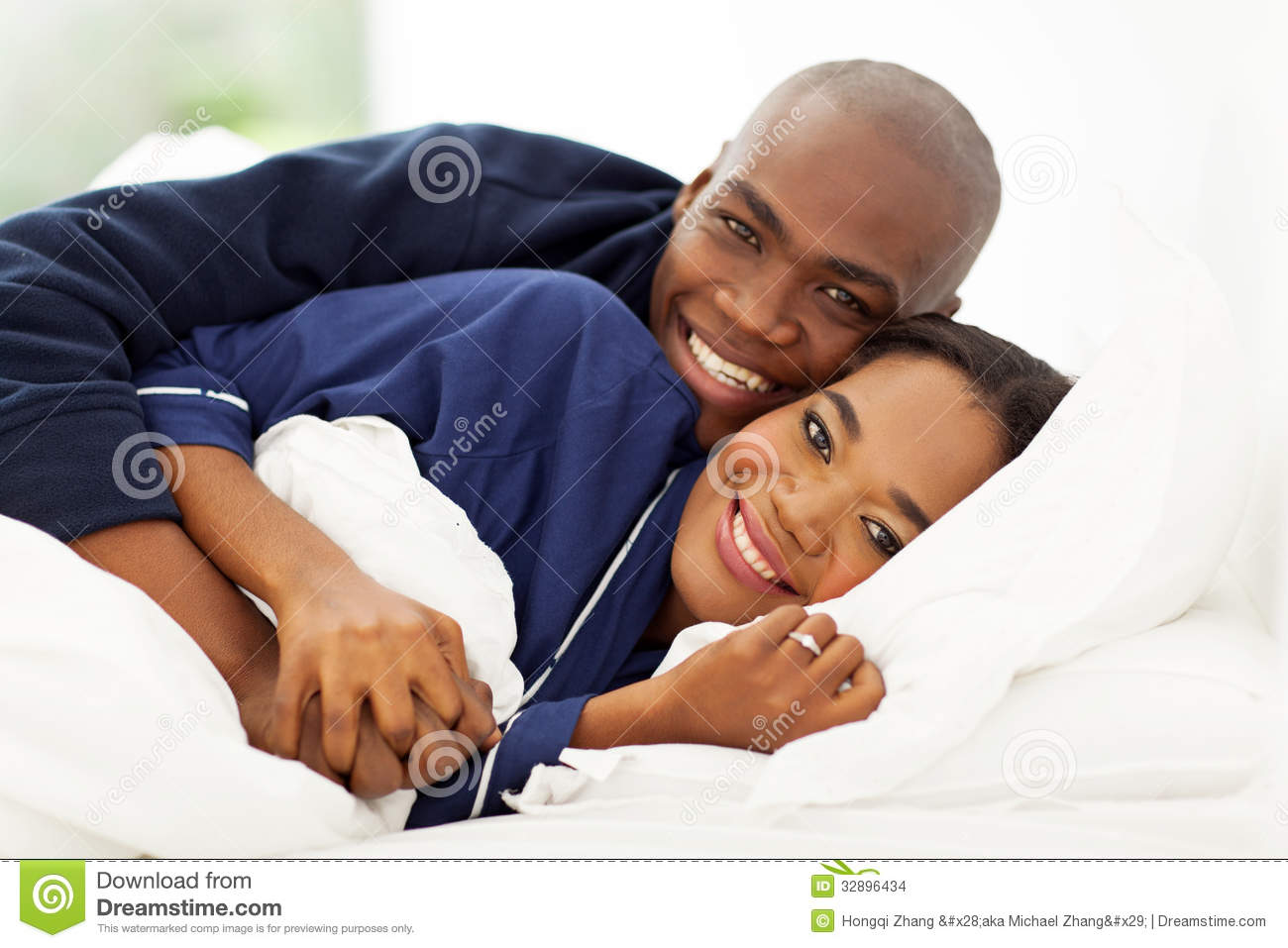 Lovely African American Couple Sleeping In Bed 