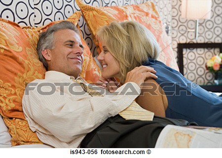 Stock Image   Mature Couple Lying On Bed  Fotosearch   Search Stock    