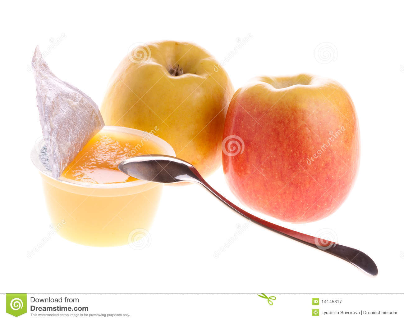 Apple Sauce With Spoon And Two Fresh Apples