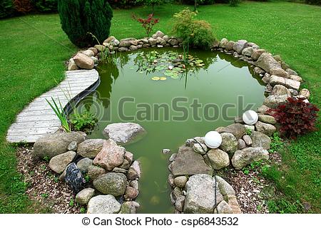 Beautiful Classical Design Garden Fish Pond In A Well Cared Backyard
