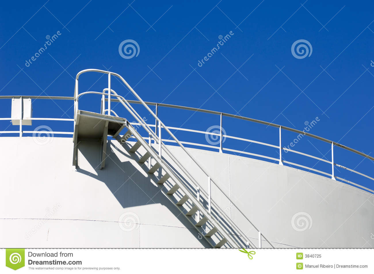Oil Reservoir Detail With Acess Ladder Against A Blue Sky 