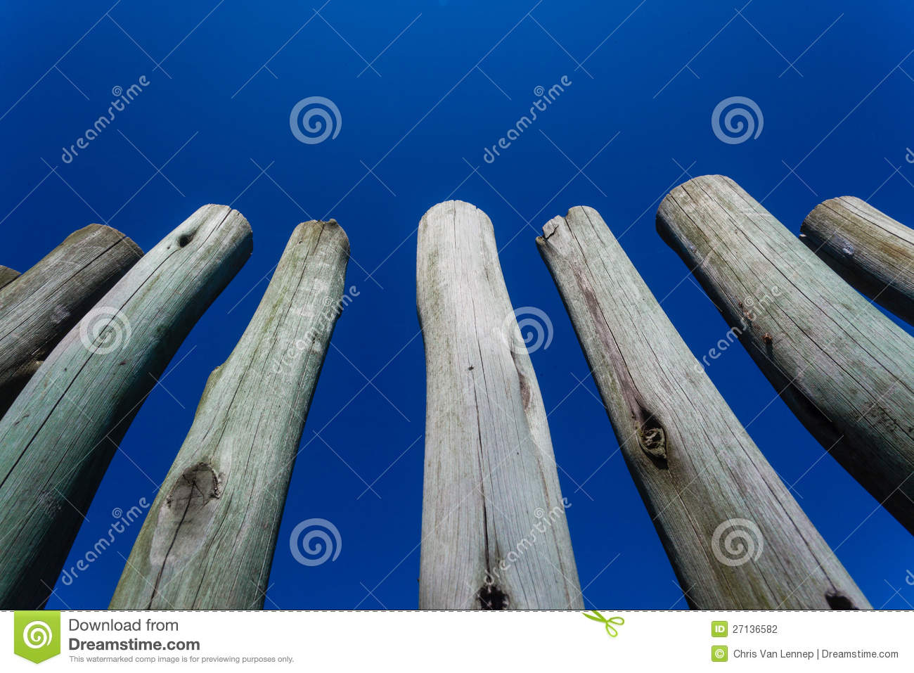 Photo Image Close To The Small Round Wood Poles Secured To The    