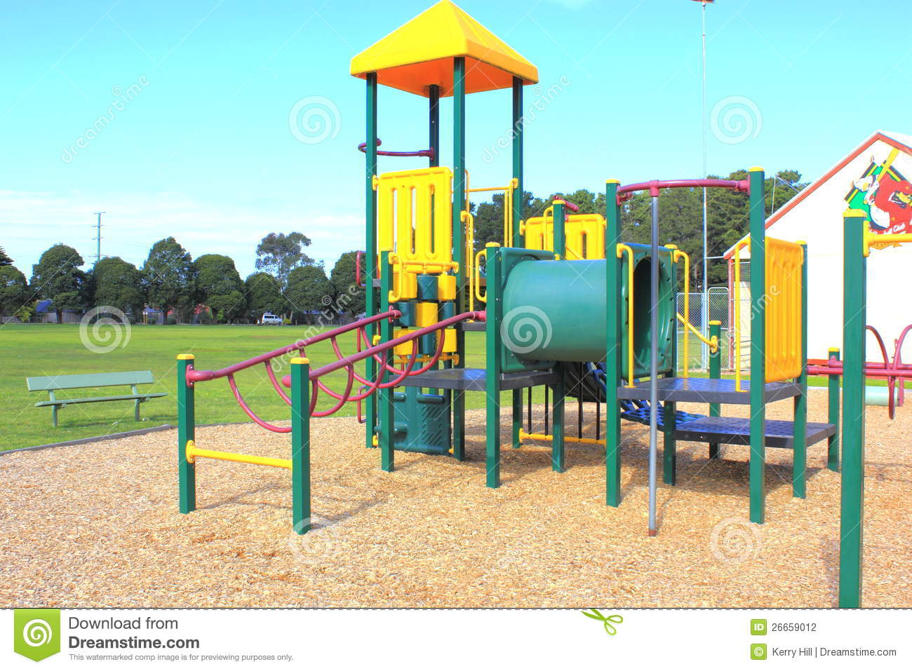 Childrens Playground Equipment At A Local Park With Wood Chip Playing