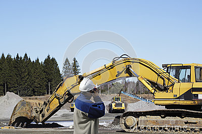 Giant Bulldozers And Trucks Inside Sand And Gravel Industry Worker    