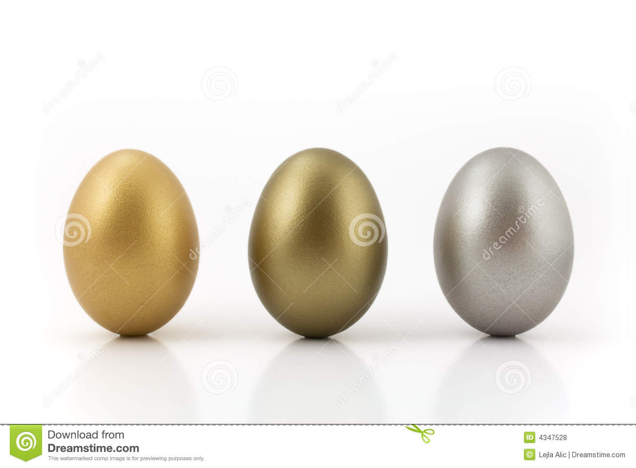 Golden Bronze And Silver Eggs Isolated On White Background
