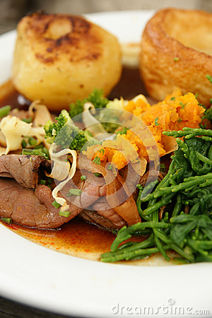 Roast Beef Dinner With Roast Potatoes Yorkshire Pudding And