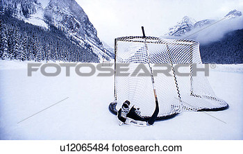 Ice Skates Hockey Stick And Hocky Net On Lake Louise Banff National