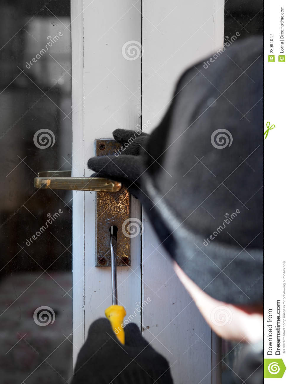 Breaking And Entering Home Or House Burglar With Screwdriver Force