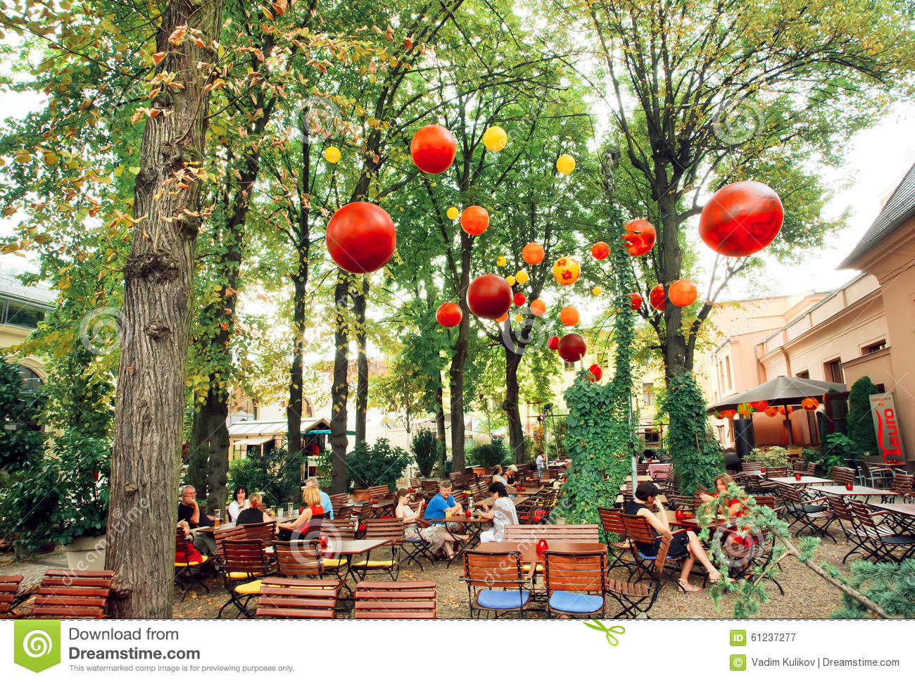 Lounge Restaurant With People Relaxing Under Green Trees Editorial    