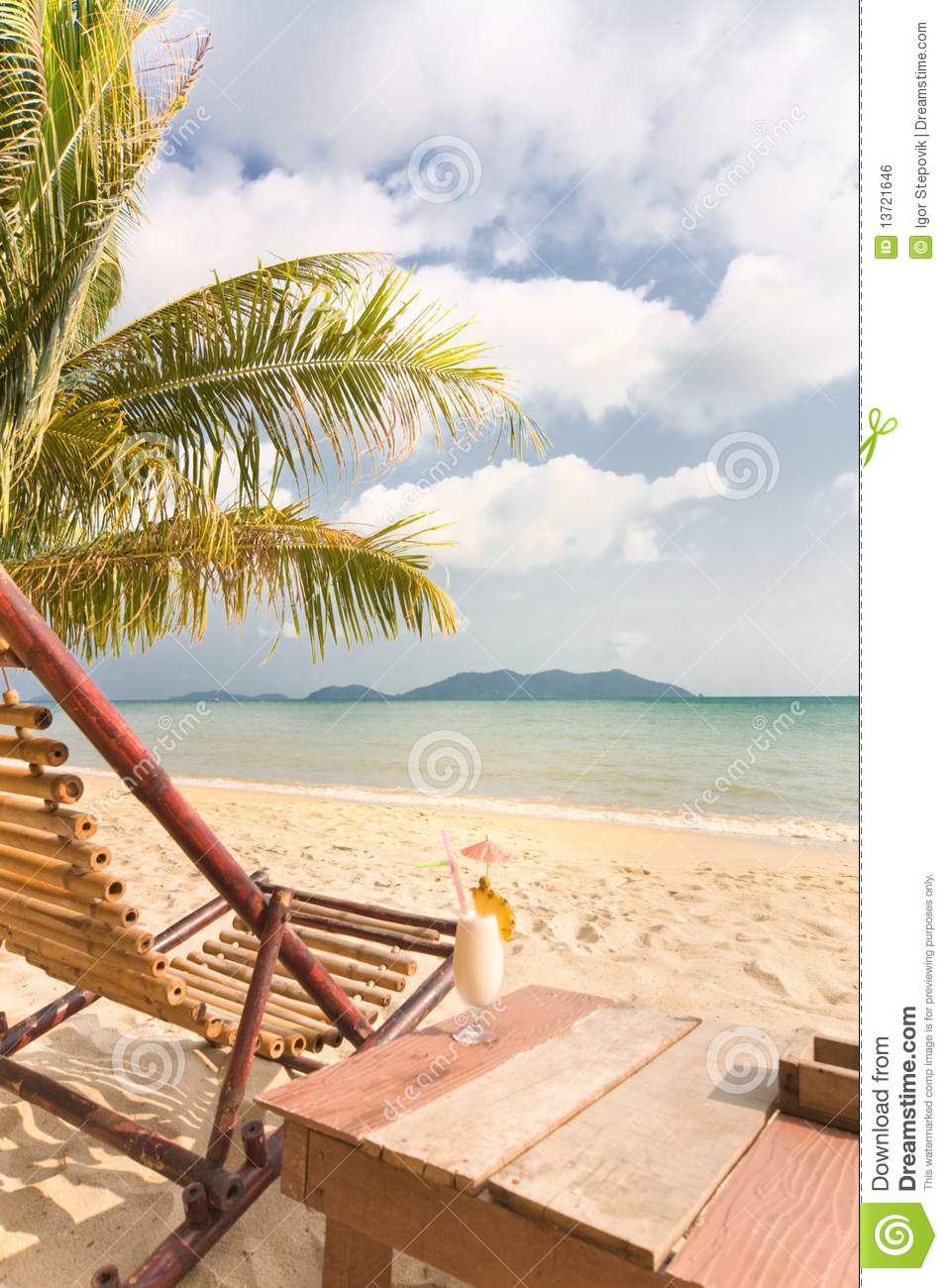 Relaxing Under A Palm Trees With Cocktail Royalty Free Stock Image
