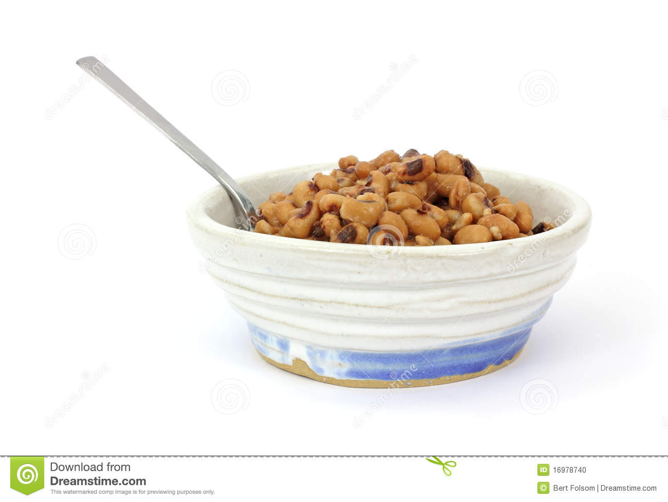 Large Serving Of Black Eyed Peas In An Old Bowl With Spoon On A White