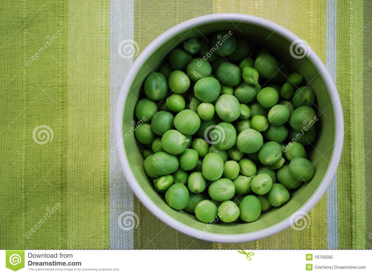Ripe Sweet Green Peas In A Ceramic Bowl On Green Striped Background