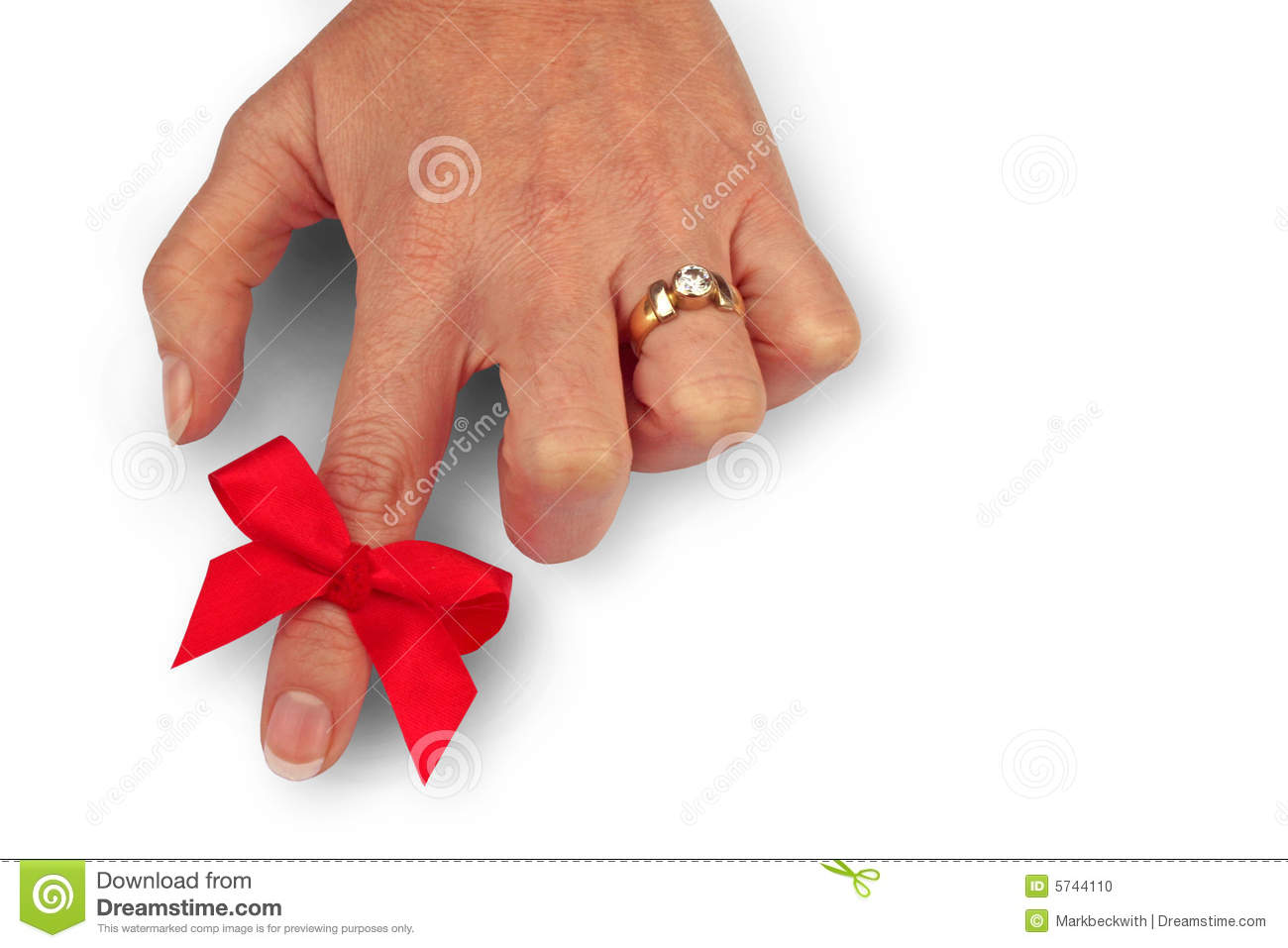 Red Ribbon Tied Around Index Finger As A Reminder
