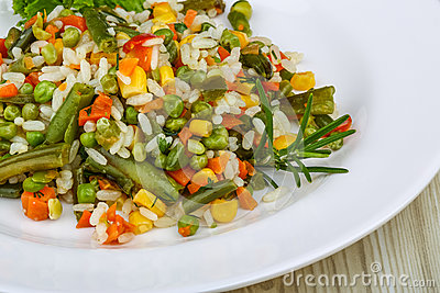 Mexican Rice With Vegetables And Salad Leaves