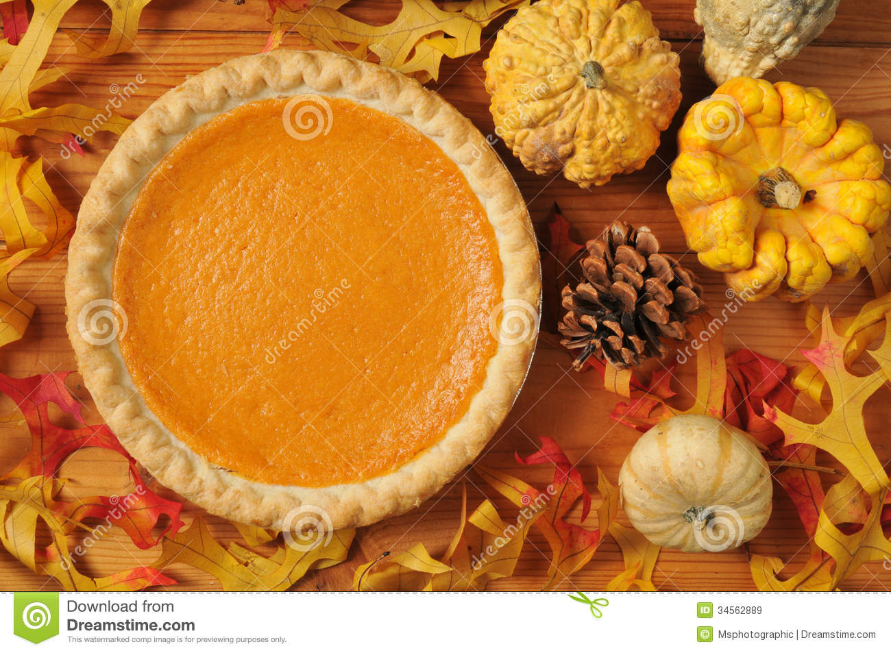 Whole Sweet Potato Pie On An Artistic Set With Autumn Leaves Squash