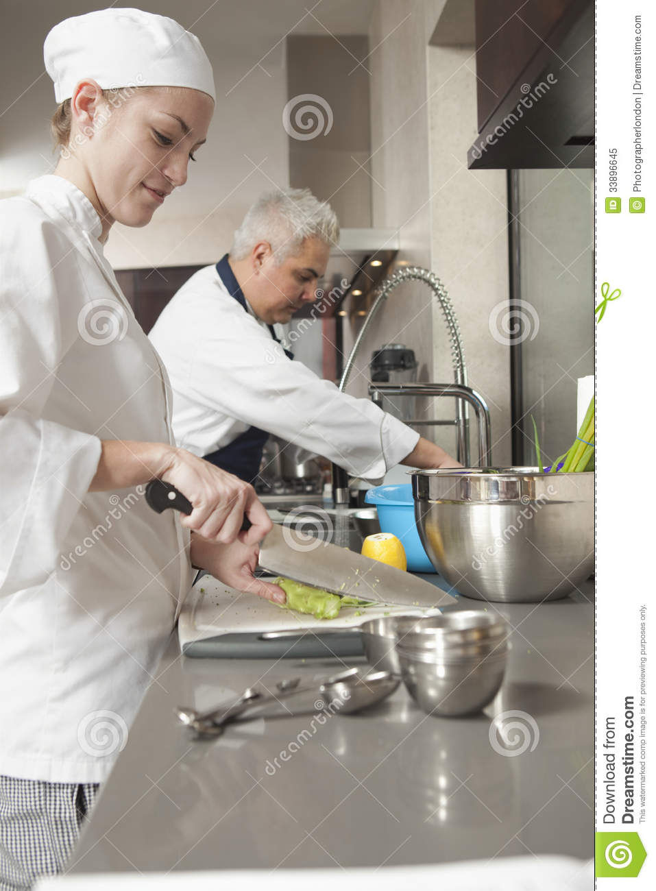 Chefs Working In Commercial Kitchen Royalty Free Stock Photo   Image    