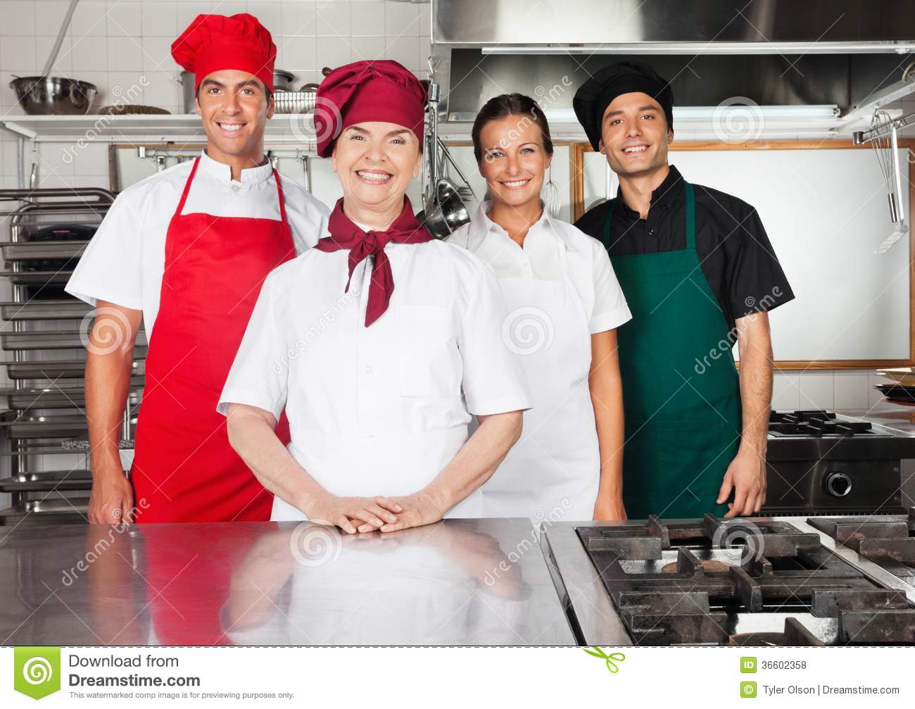 Happy Chefs Standing Together In Kitchen Royalty Free Stock Photos    