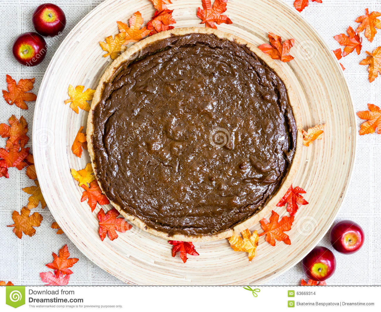 Rustic Homemade Pumpkin Pie On A Round Plate With Fall Decorations 