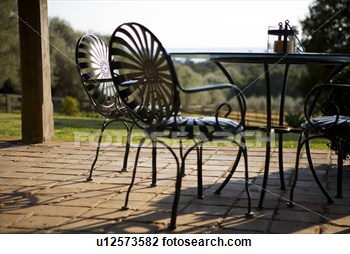 Stock Photo   Wrought Iron Patio Furniture  Fotosearch   Search Stock