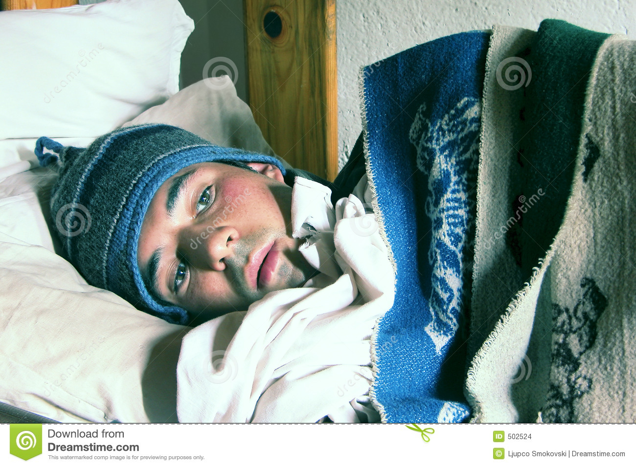 Young Man In A Bed Feeling Cold Stock Images   Image  502524